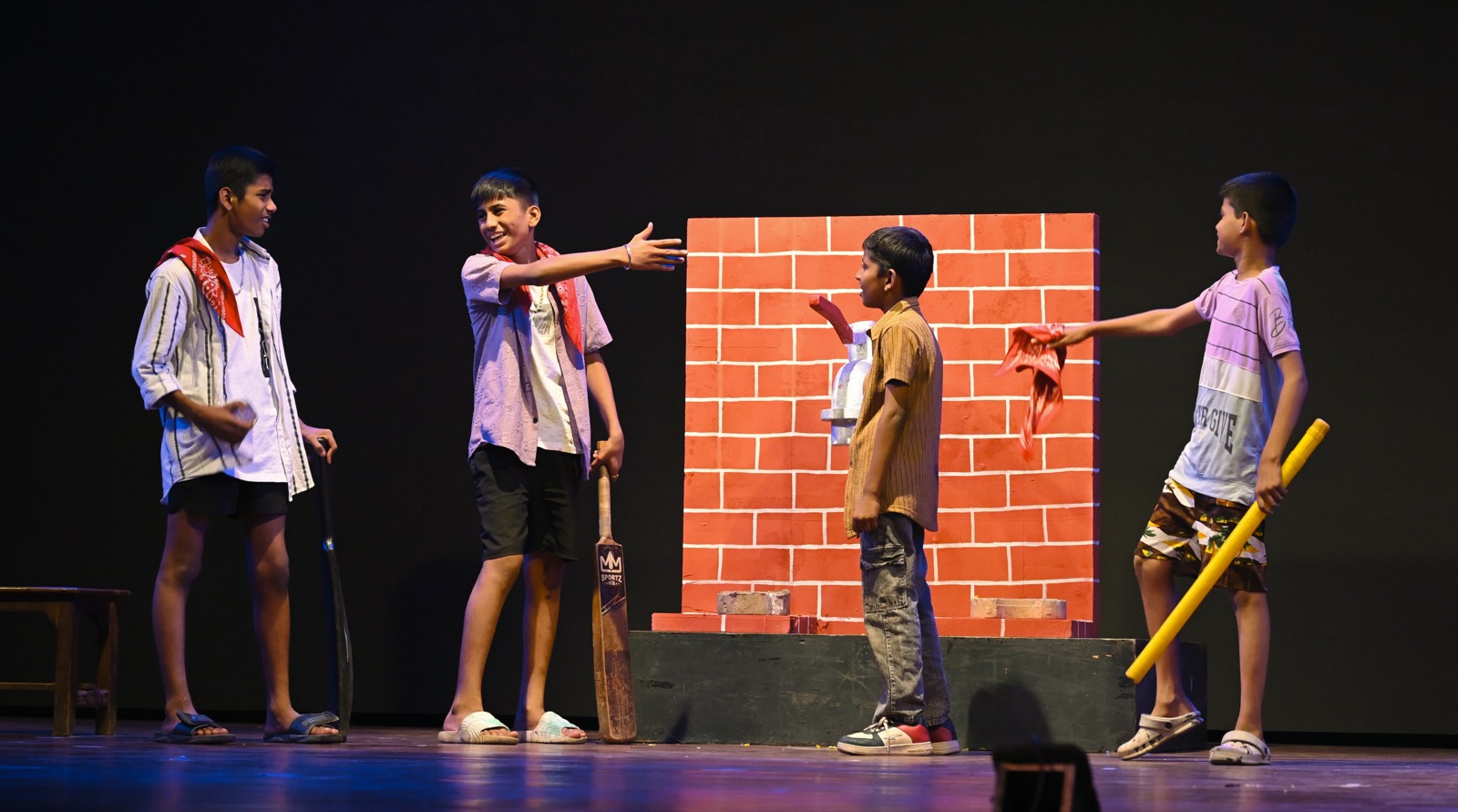 Rival gangs face off across a brick wall